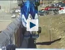Car flipping over guardrail