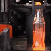 Red hot glass Coke bottle